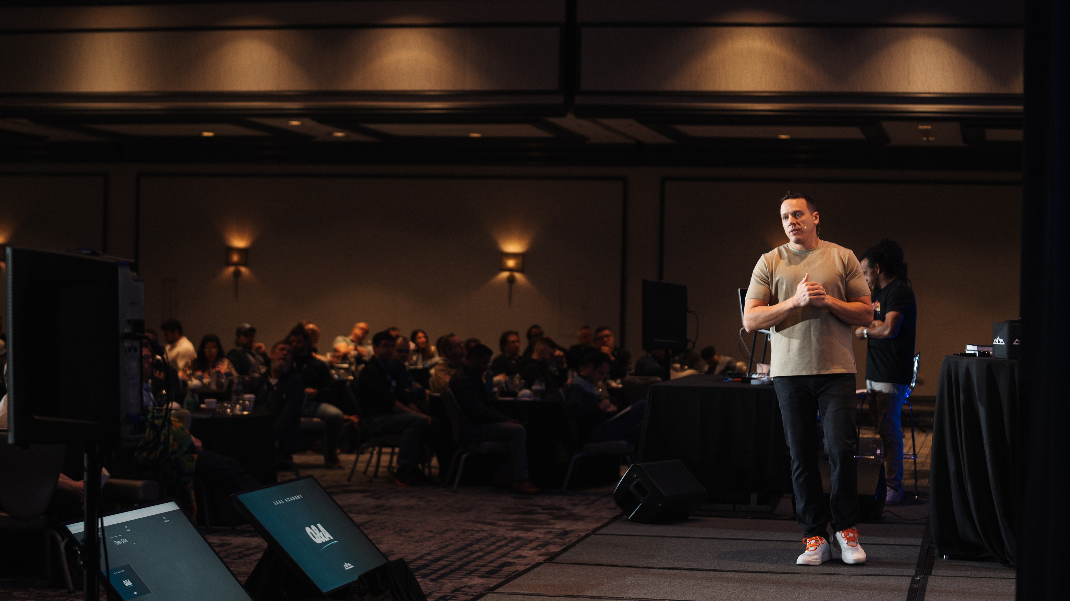 SaaS Academy founders on stage